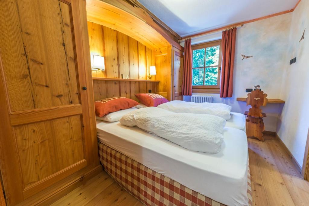 Postel nebo postele na pokoji v ubytování Rifugio Lago Nambino