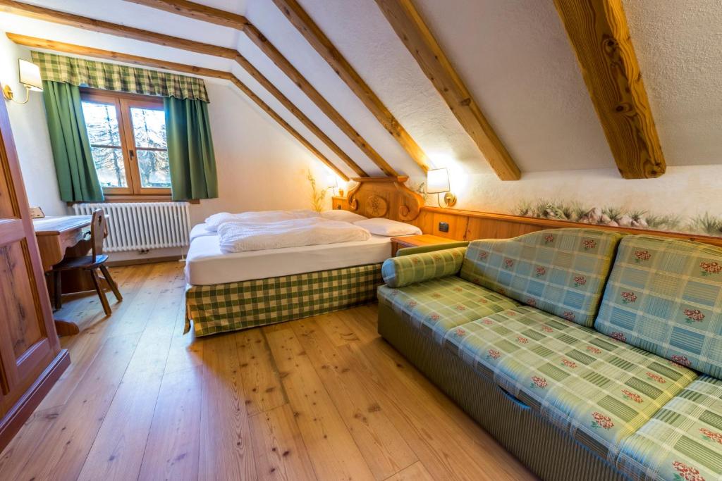 Postel nebo postele na pokoji v ubytování Rifugio Lago Nambino
