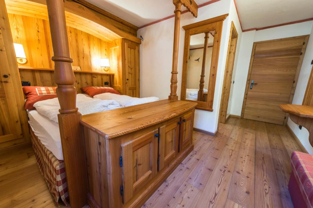 Postel nebo postele na pokoji v ubytování Rifugio Lago Nambino