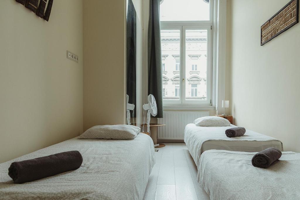 Posteľ alebo postele v izbe v ubytovaní Jozsef63 Apartment