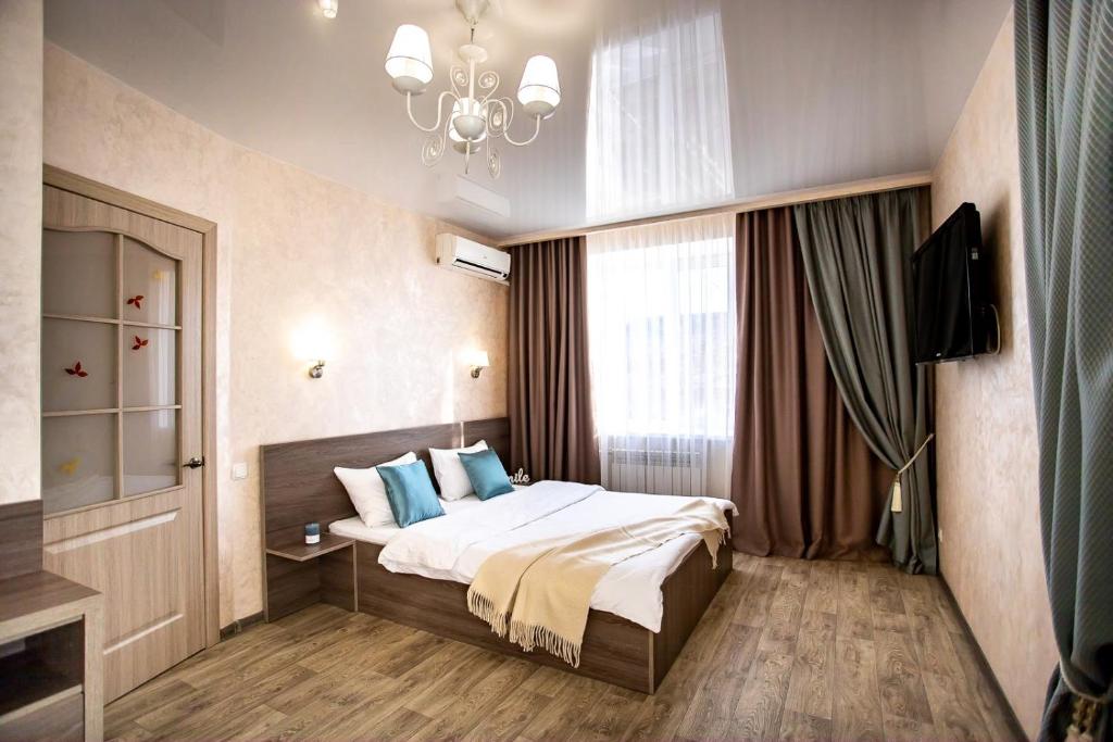 En eller flere senge i et værelse på Студия на Адмиральской