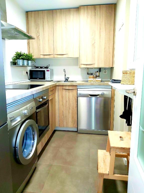 Kuchyň nebo kuchyňský kout v ubytování COSTA NORTE GYM Apartamento con Terraza Garaje y Piscina
