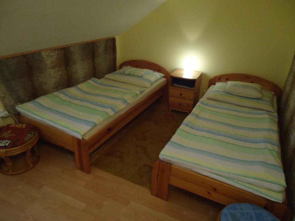 Postel nebo postele na pokoji v ubytování Czermann Panzió és Étterem