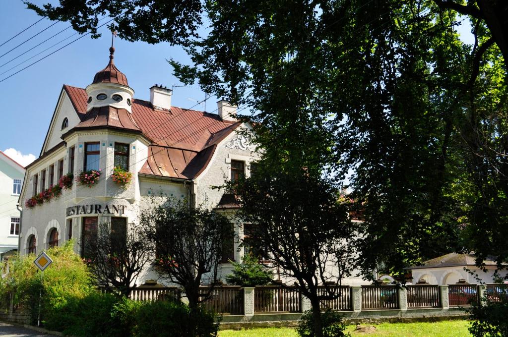 a house with a face on the top of it at Penzion U Krejzů in Dolní Poustevna