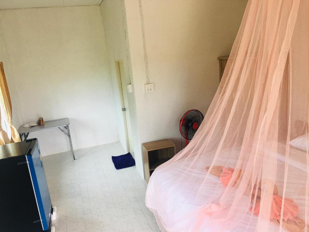 Postel nebo postele na pokoji v ubytování Happy Home Kohjum