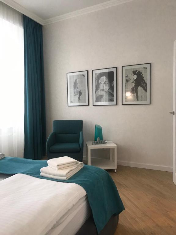 Postel nebo postele na pokoji v ubytování Lviv Apartments