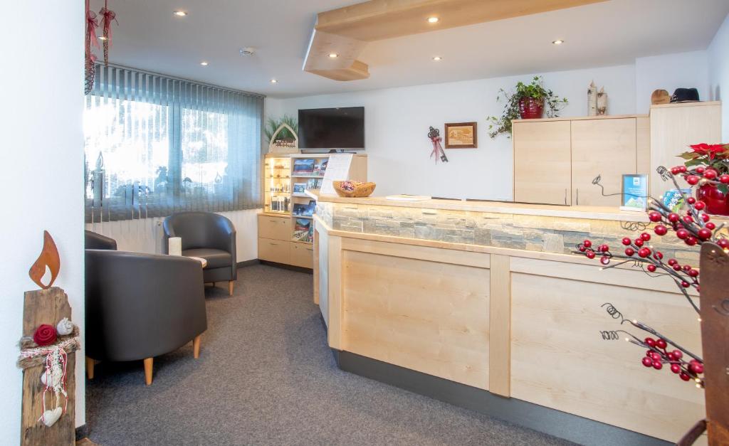 TV a/nebo společenská místnost v ubytování OLYMPIA Privathotel Garni