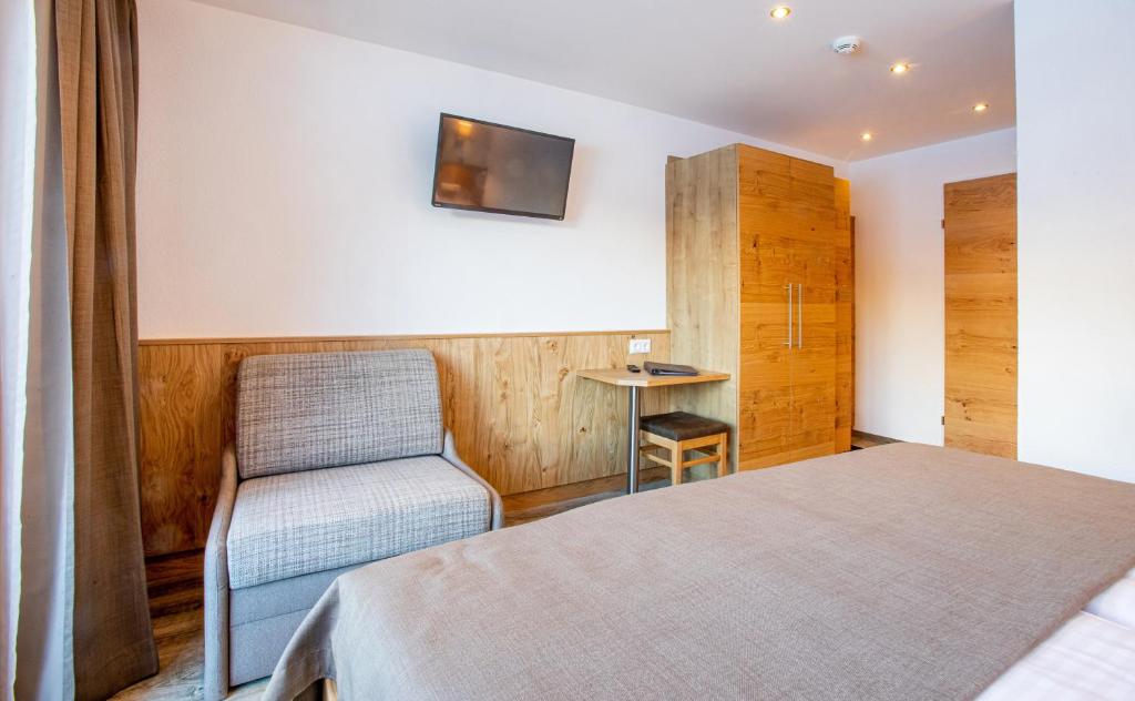 Postel nebo postele na pokoji v ubytování OLYMPIA Privathotel Garni