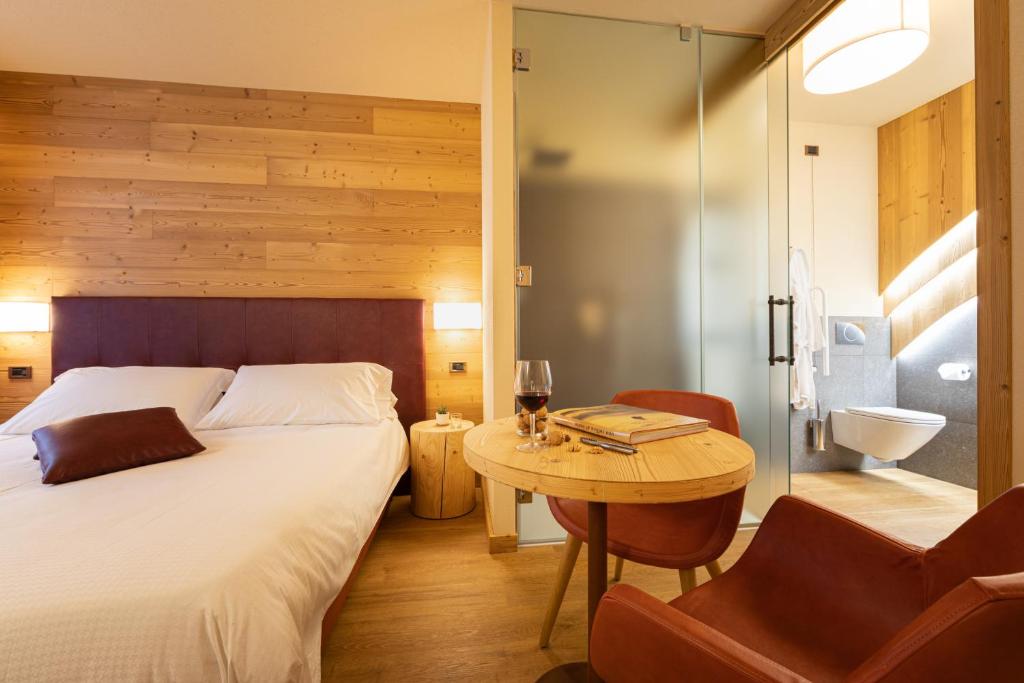 Postel nebo postele na pokoji v ubytování Hotel Petit Tournalin
