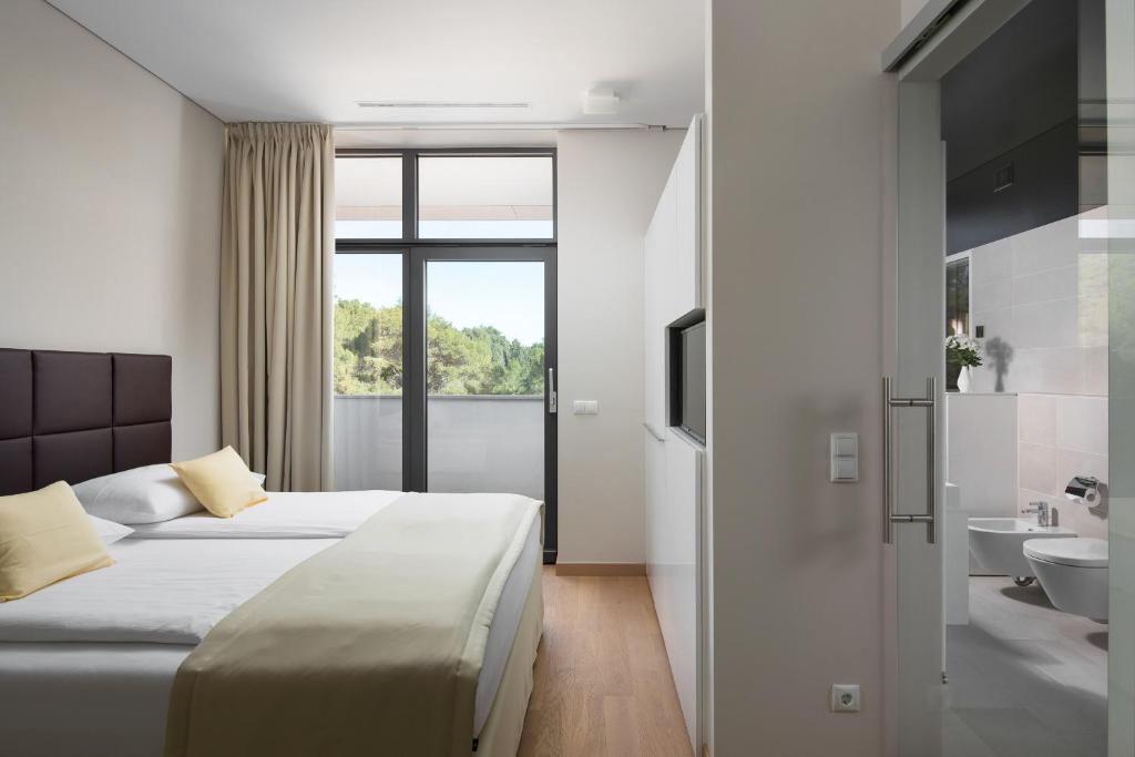 Posteľ alebo postele v izbe v ubytovaní Istra-Hvar Luxury Penthouse