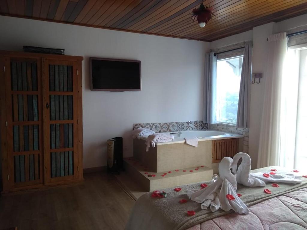 Postel nebo postele na pokoji v ubytování Pousada Casa Pinha
