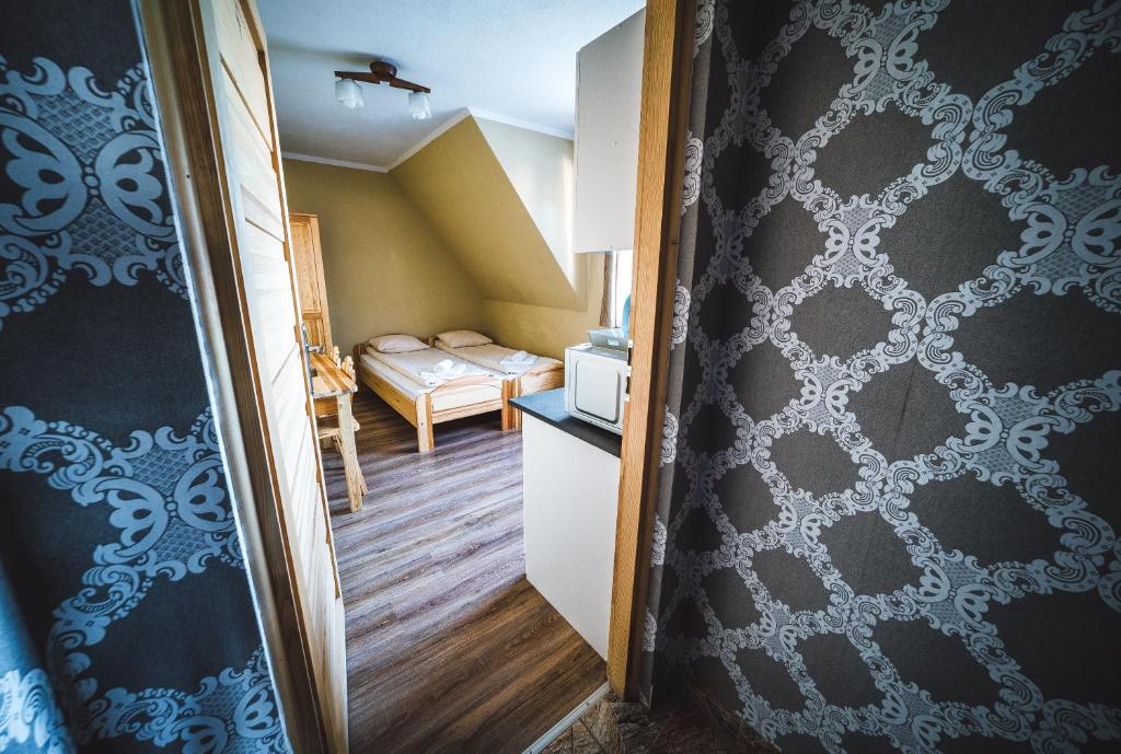 Posteľ alebo postele v izbe v ubytovaní Pokoje i Apartamenty Nad Potokiem