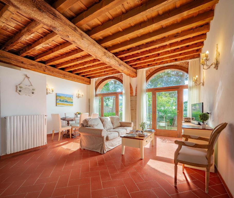 a living room with a couch and a table at Florence Country Residence in Vaglia