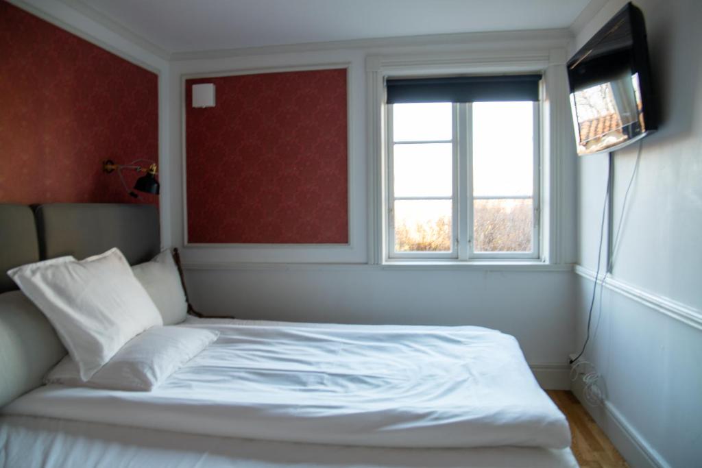 Postel nebo postele na pokoji v ubytování Mamma Carinas Pensionat B&B