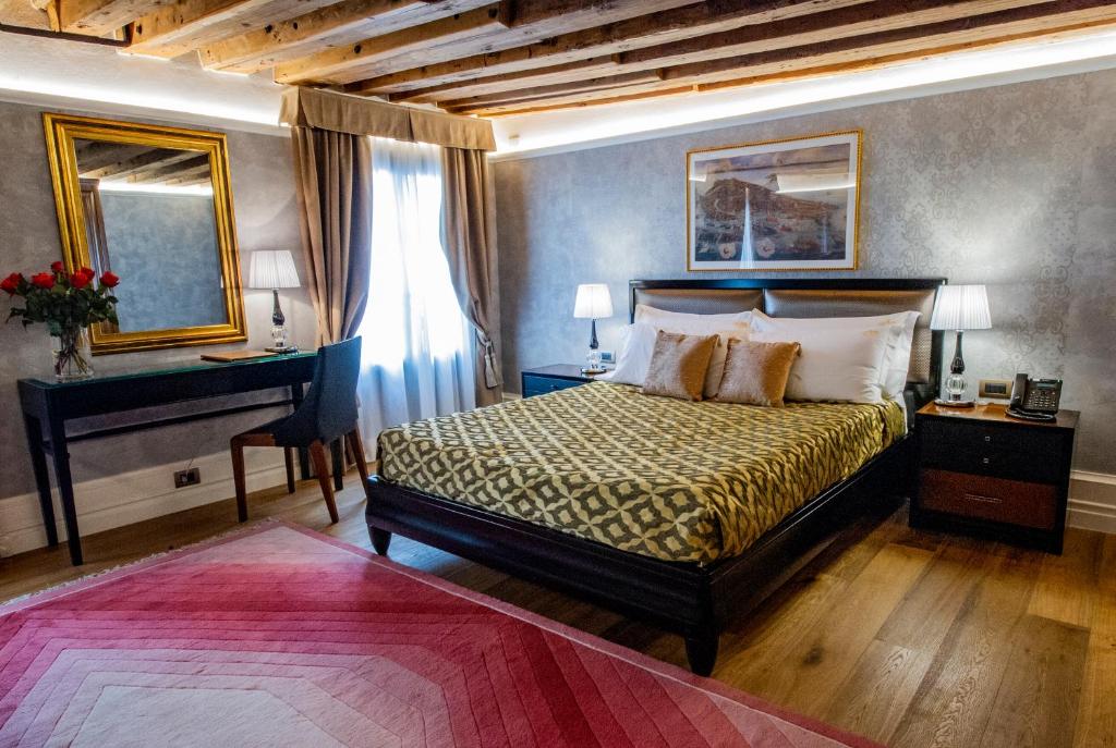 Postel nebo postele na pokoji v ubytování EGO' Residence Venice