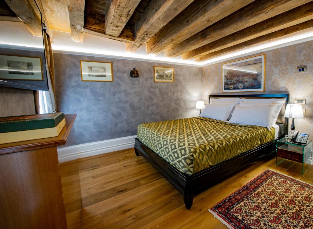 Postel nebo postele na pokoji v ubytování EGO' Residence Venice