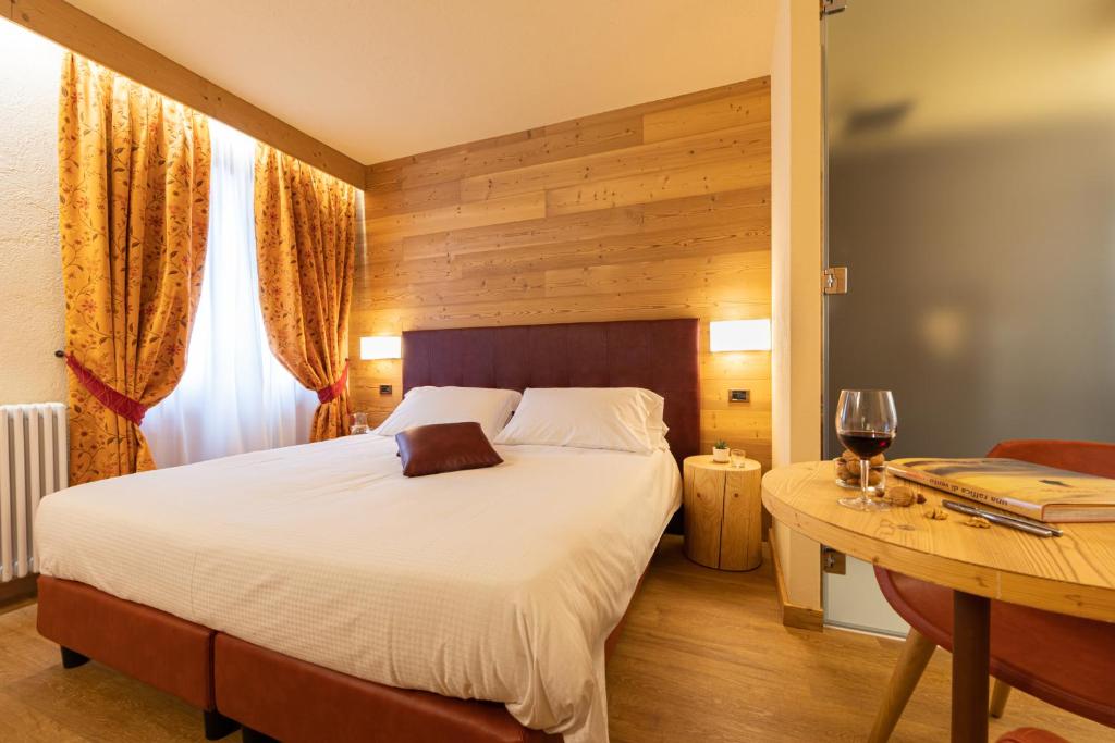 Postel nebo postele na pokoji v ubytování Hotel Petit Tournalin