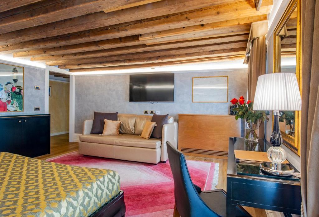Postel nebo postele na pokoji v ubytování EGO' Residence Venice