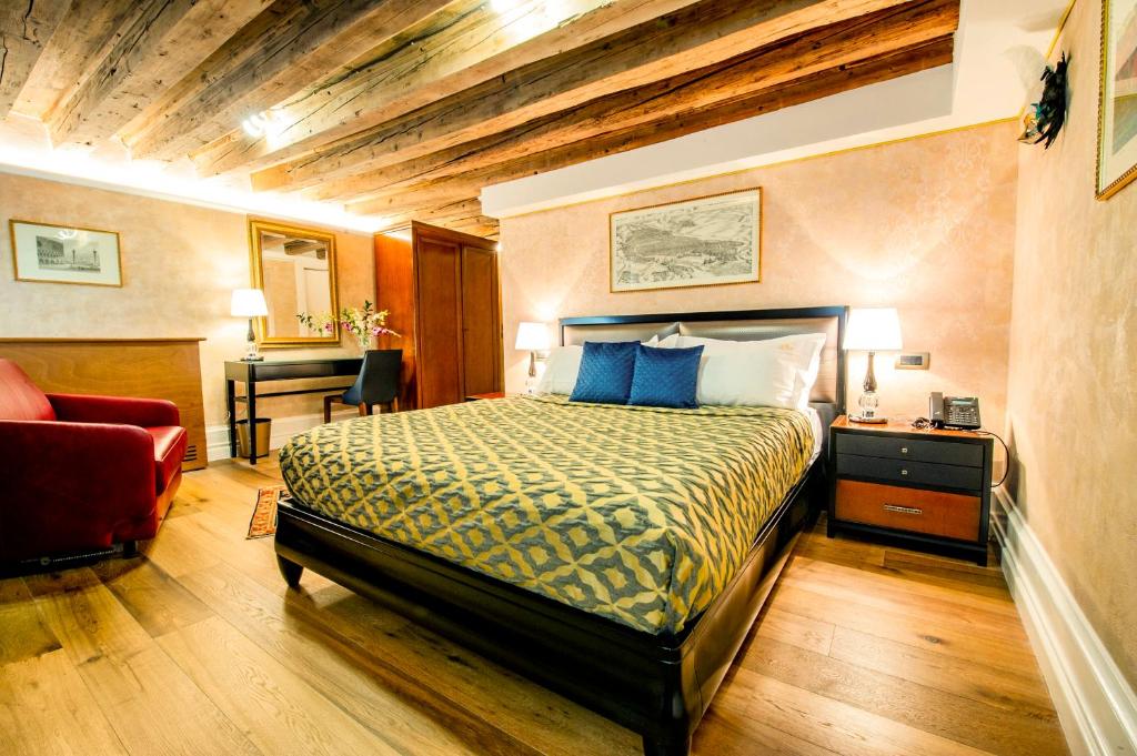 Postel nebo postele na pokoji v ubytování EGO' Residence Venice