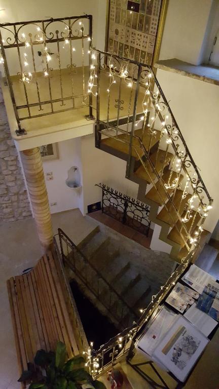 a set of stairs leading up to a dining room at Antica Corte B&B in Malcesine