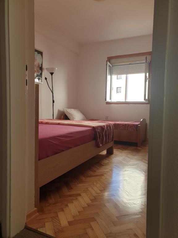 Lova arba lovos apgyvendinimo įstaigoje Apartments Zenit