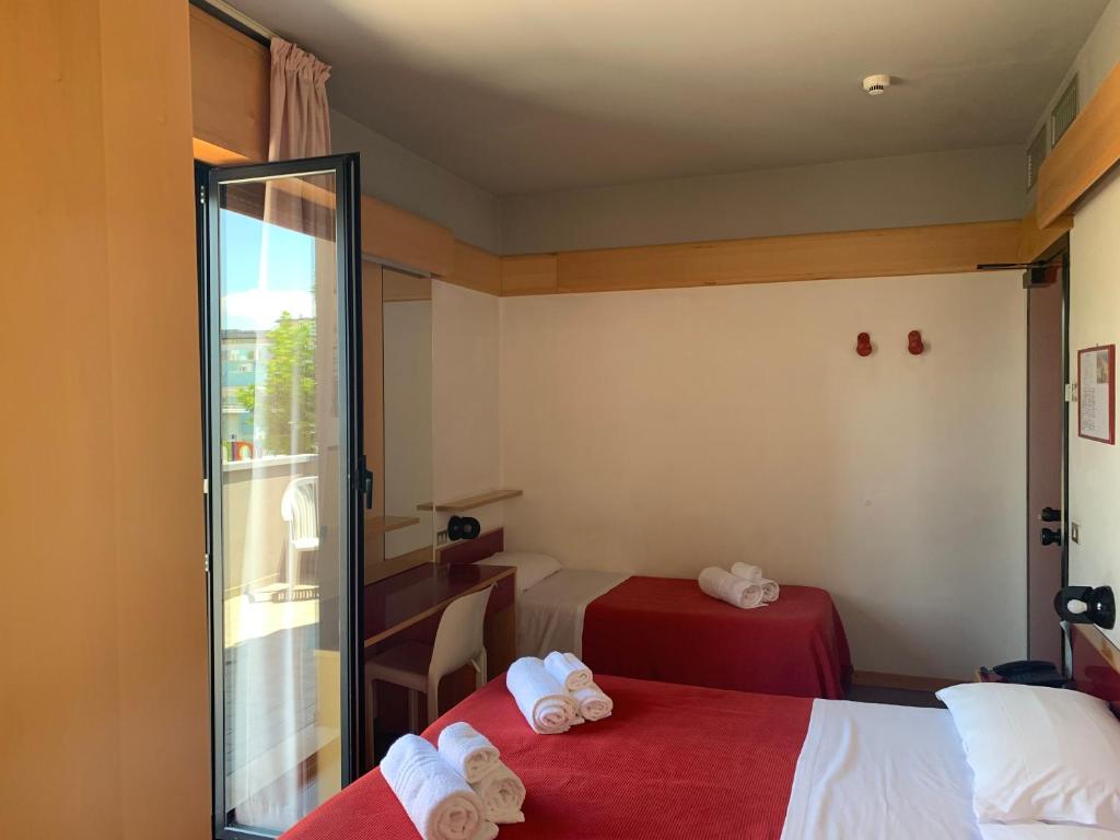 Postel nebo postele na pokoji v ubytování Hotel Giglio