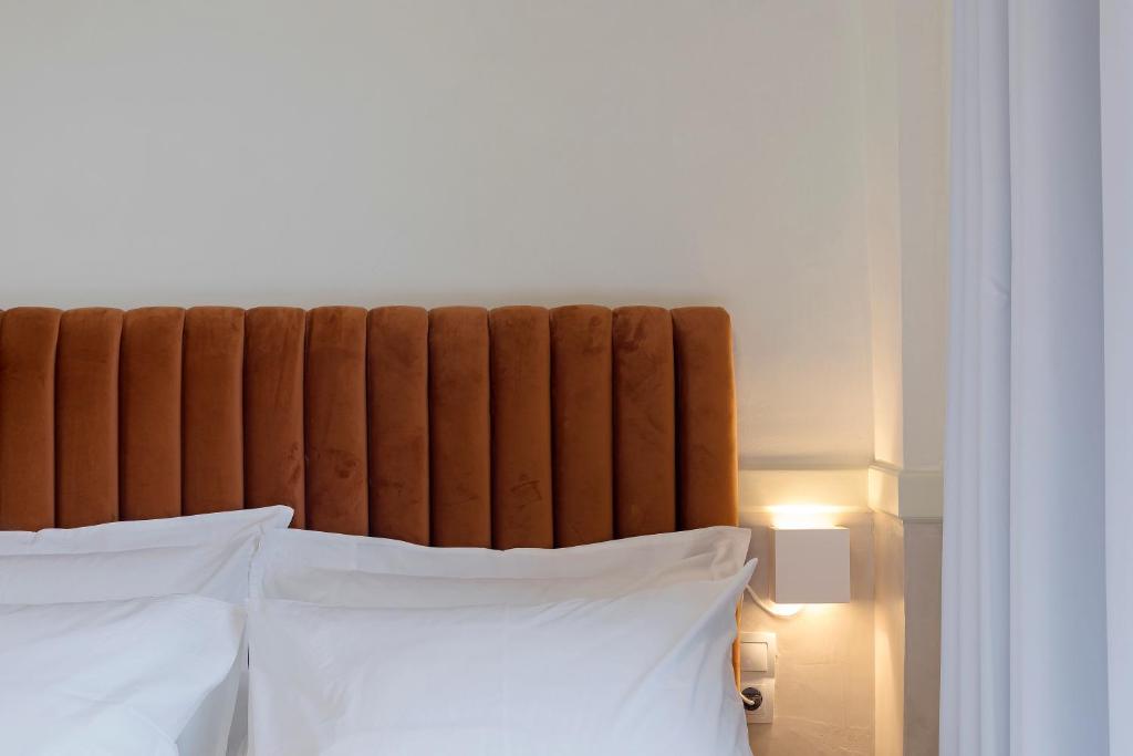 Posteľ alebo postele v izbe v ubytovaní Athenian Lofts