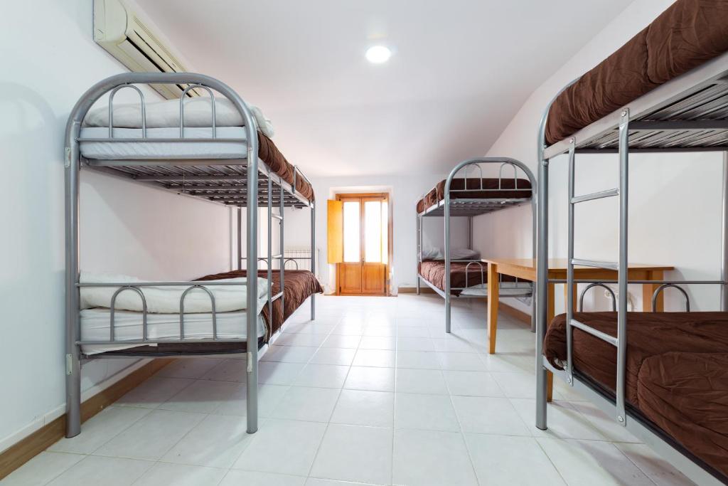 Posteľ alebo postele v izbe v ubytovaní Albergue las Veletas