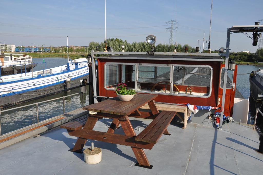 a picnic table on the side of a boat at Private Lodge on Houseboat Amsterdam in Amsterdam
