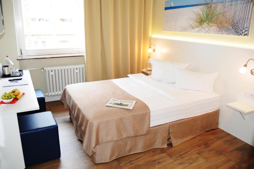 Postel nebo postele na pokoji v ubytování Hotel am Kieler Schloss by Première Classe