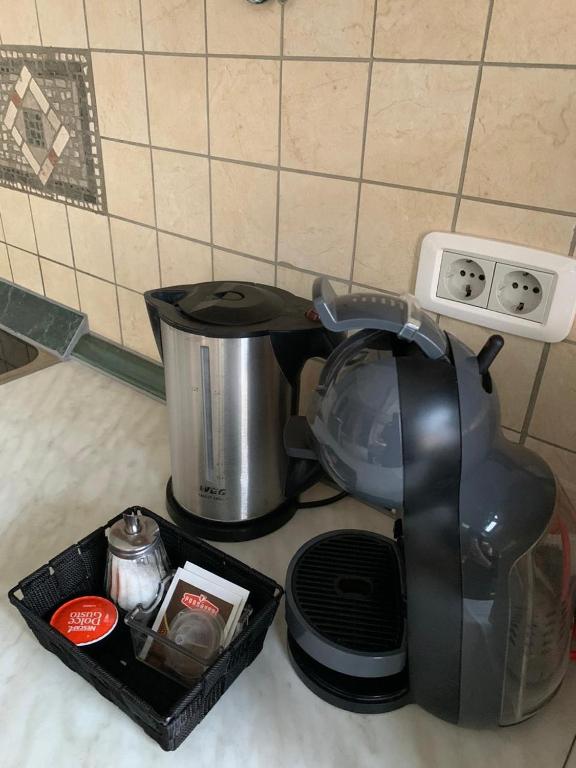 a coffee maker sitting on a kitchen counter next to a pot at Villa Edelweiss in Sveti Stefan