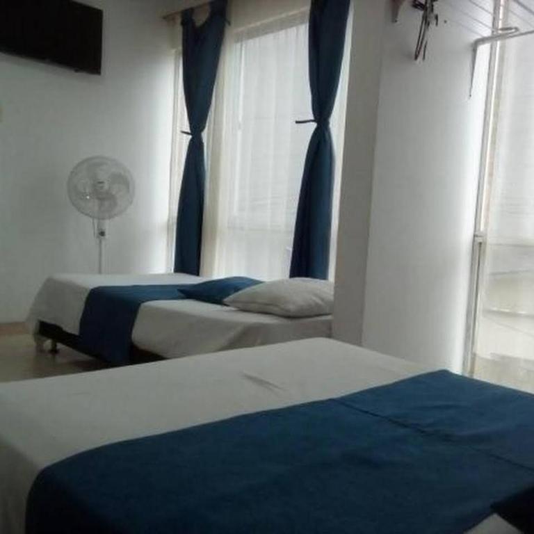 Postel nebo postele na pokoji v ubytování Hotel Luis Ángel