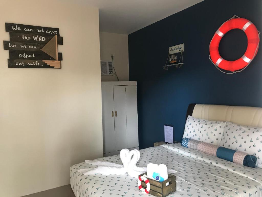 Postel nebo postele na pokoji v ubytování ANCHORAGE INN Moalboal