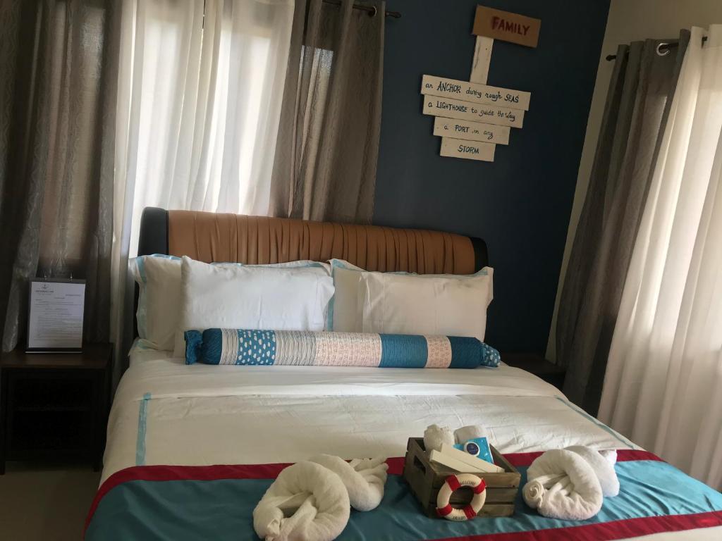 Postel nebo postele na pokoji v ubytování ANCHORAGE INN Moalboal