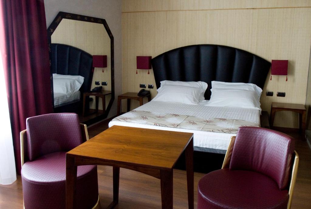 Postel nebo postele na pokoji v ubytování HM MotelHotel