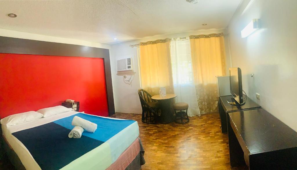 Postel nebo postele na pokoji v ubytování Maharajah Hotel