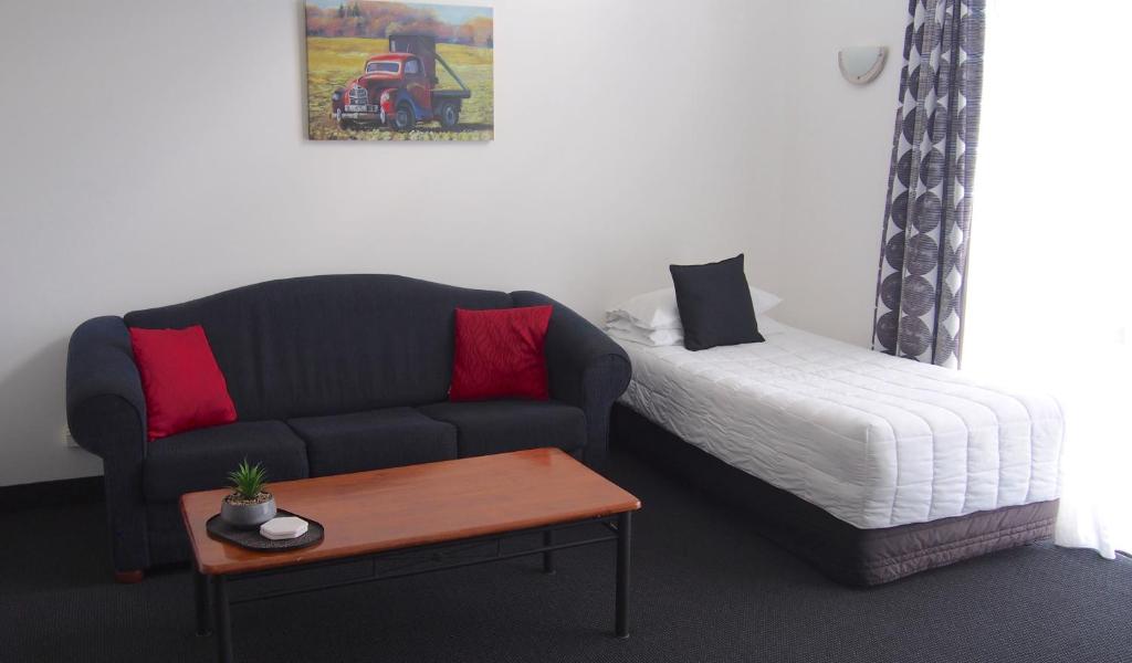 Postel nebo postele na pokoji v ubytování Totara Lodge