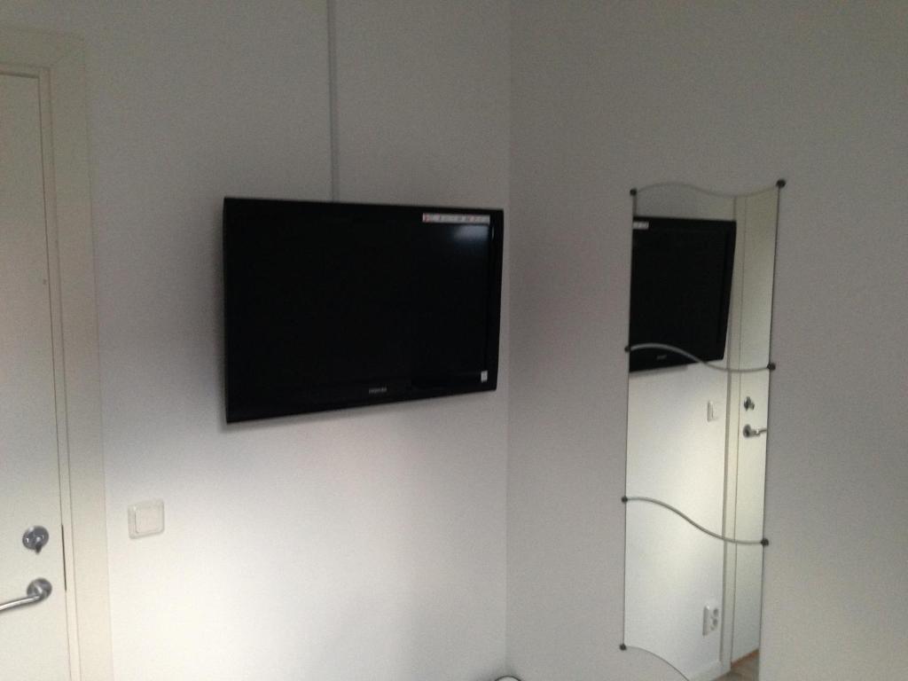 TV o dispositivi per l'intrattenimento presso Pizza House Bed Simrishamn