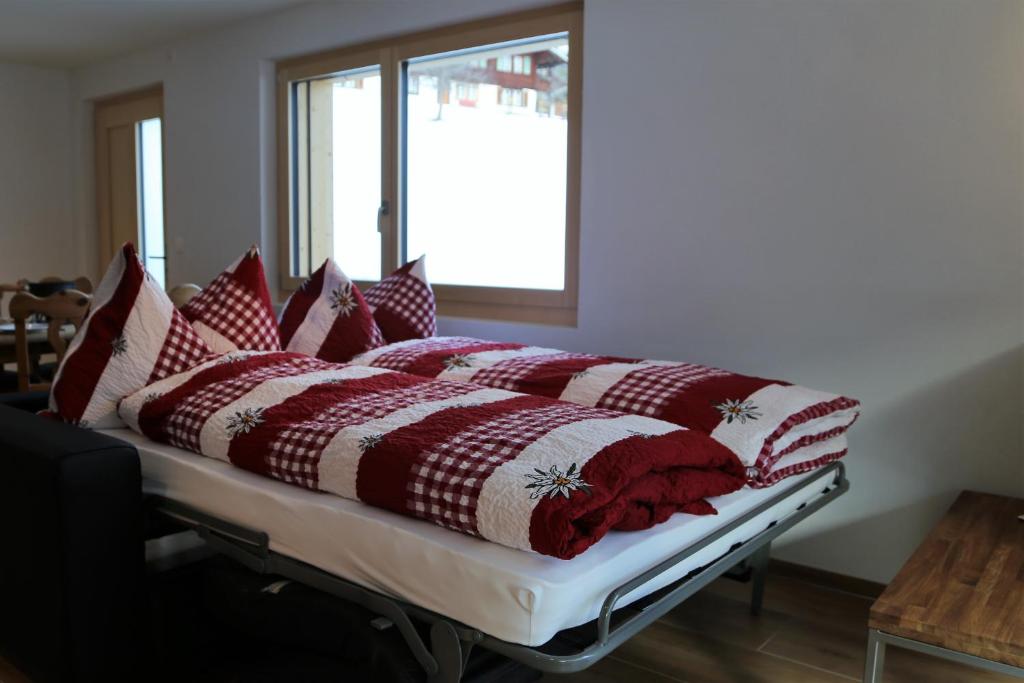 Giường trong phòng chung tại Chalet Mila