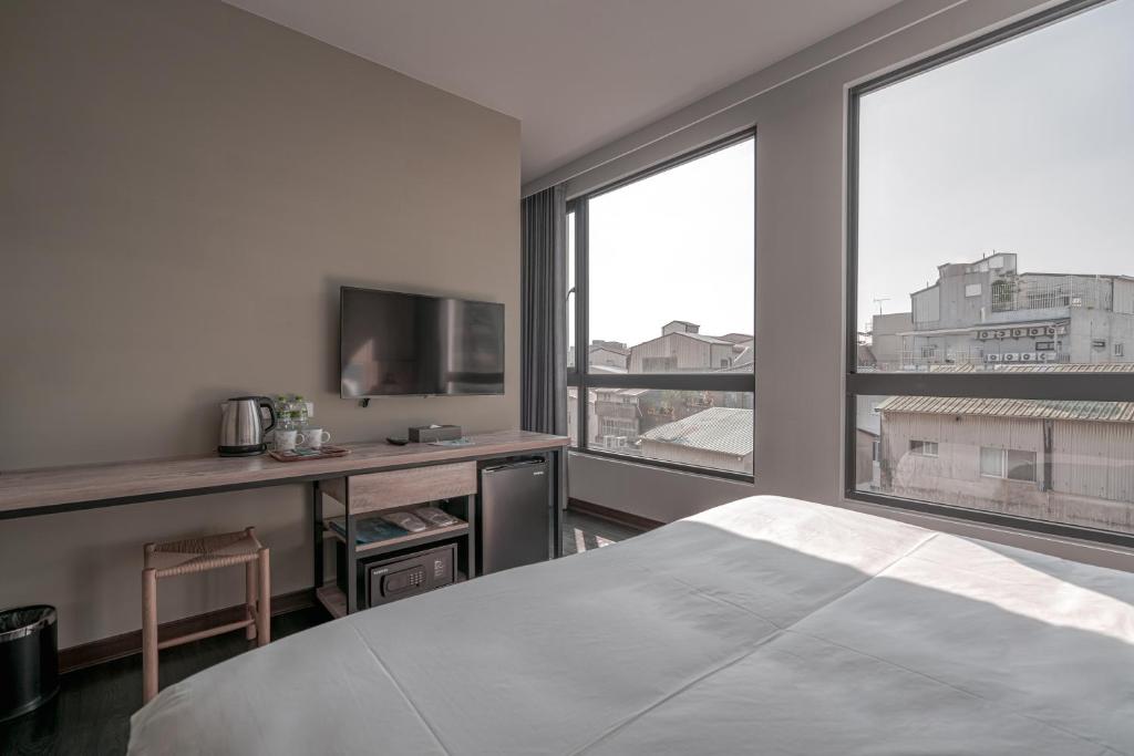 Postel nebo postele na pokoji v ubytování Somer Chew Hotel
