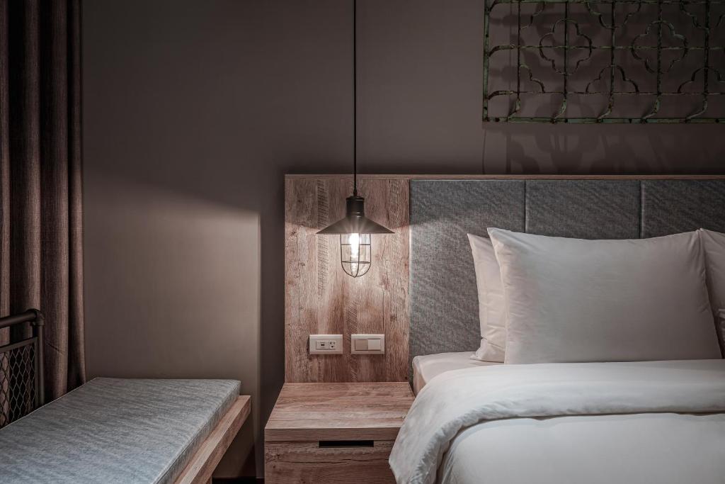 Postel nebo postele na pokoji v ubytování Somer Chew Hotel