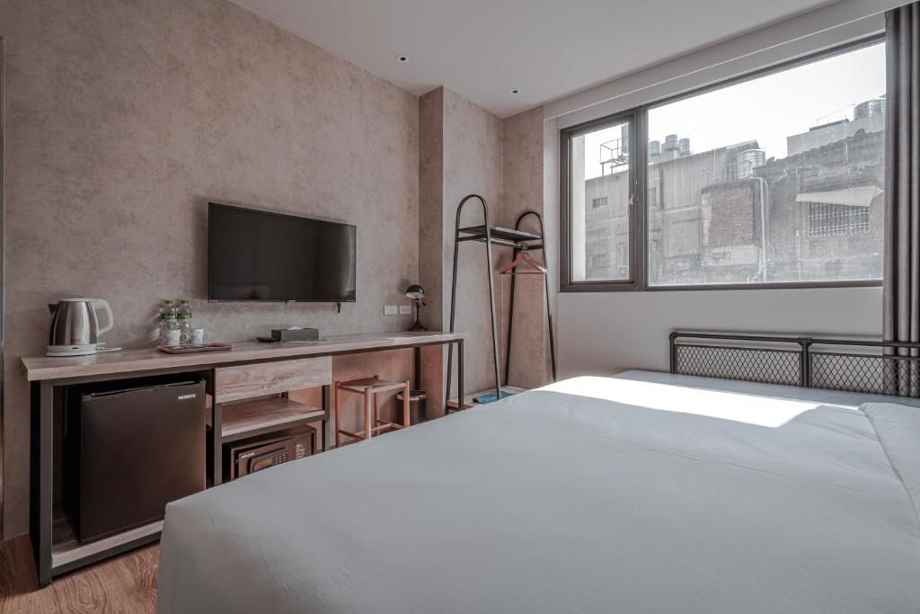 Postel nebo postele na pokoji v ubytování Somer Chew Hotel
