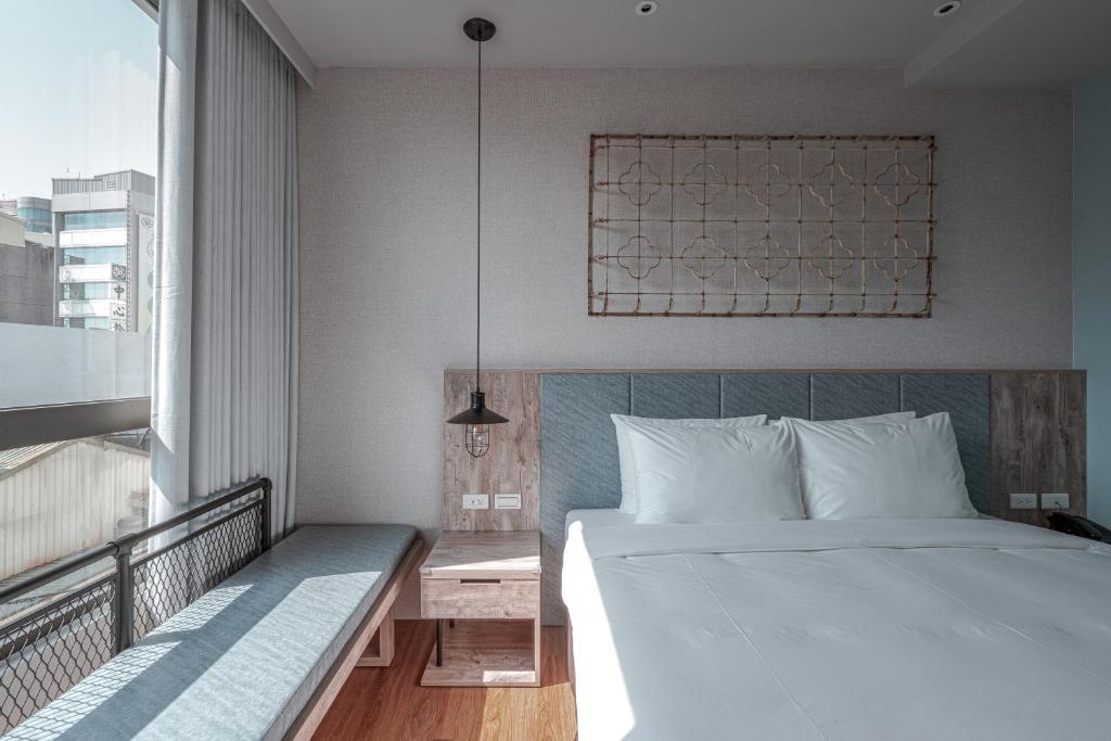 Postel nebo postele na pokoji v ubytování Somer Chew Hotel