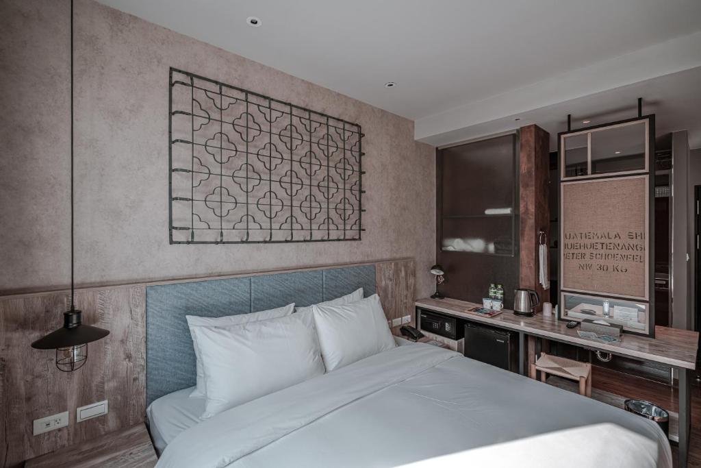 Postel nebo postele na pokoji v ubytování Somer Chew Hotel
