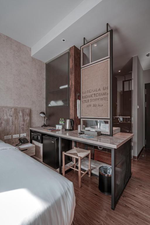Postel nebo postele na pokoji v ubytování Somer Chew Hotel