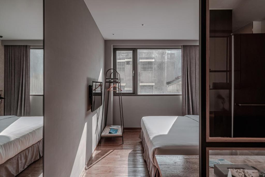 Postel nebo postele na pokoji v ubytování Somer Chew Hotel