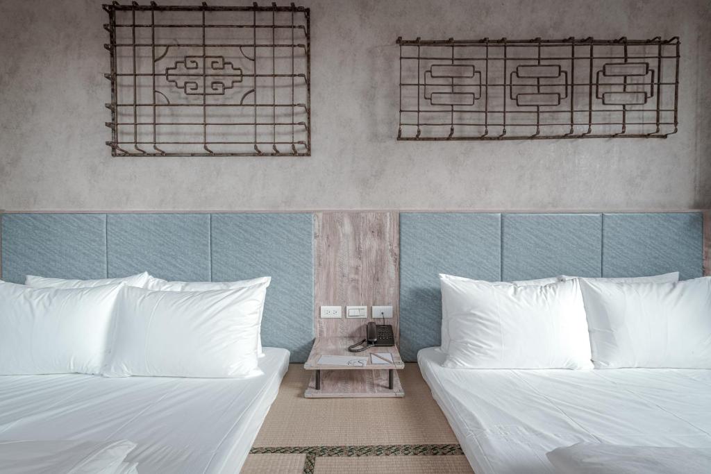 Postel nebo postele na pokoji v ubytování Somer Chew Hotel