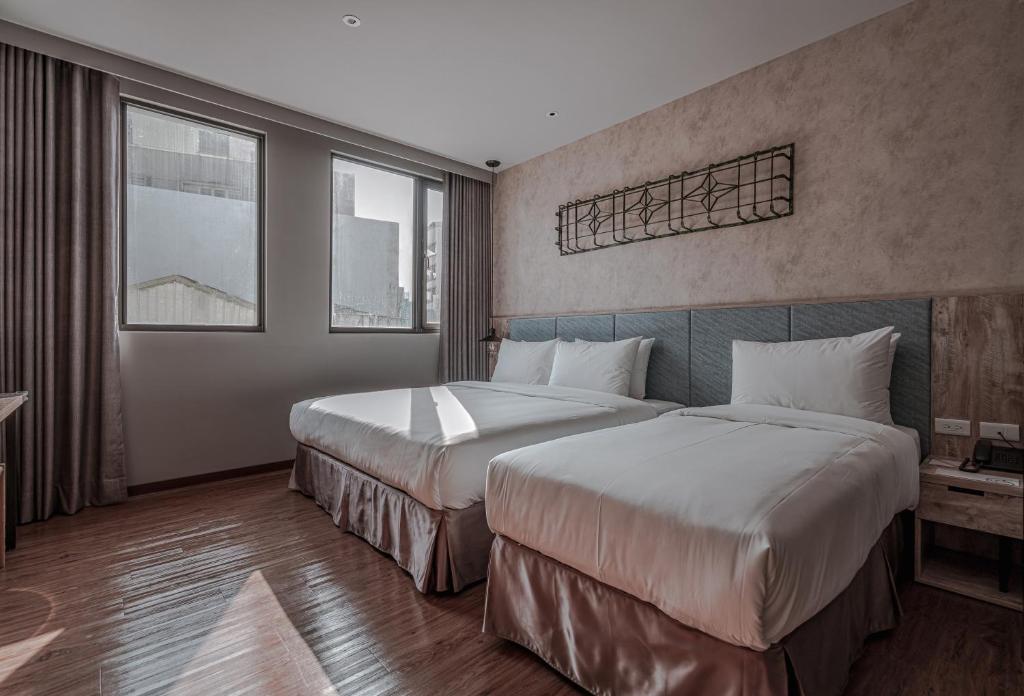 Postel nebo postele na pokoji v ubytování Somer Chew Hotel