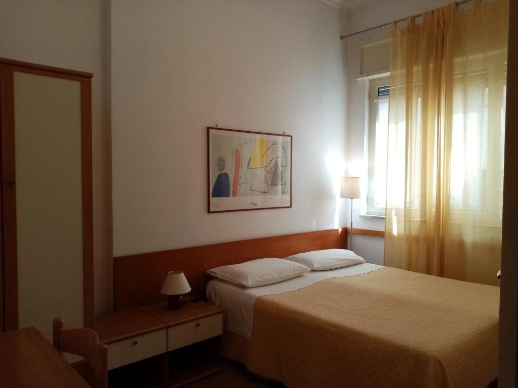 Postel nebo postele na pokoji v ubytování Ariston Petit Hotel