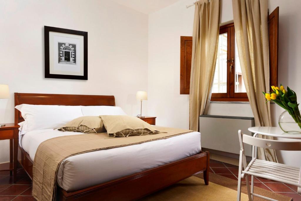 Letto o letti in una camera di Roma Resort Termini